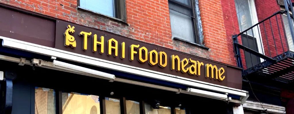 The virtual marketer - blog seo tips for private schools - meme image for local seo showing restaurant sign reading 'thai food near me'